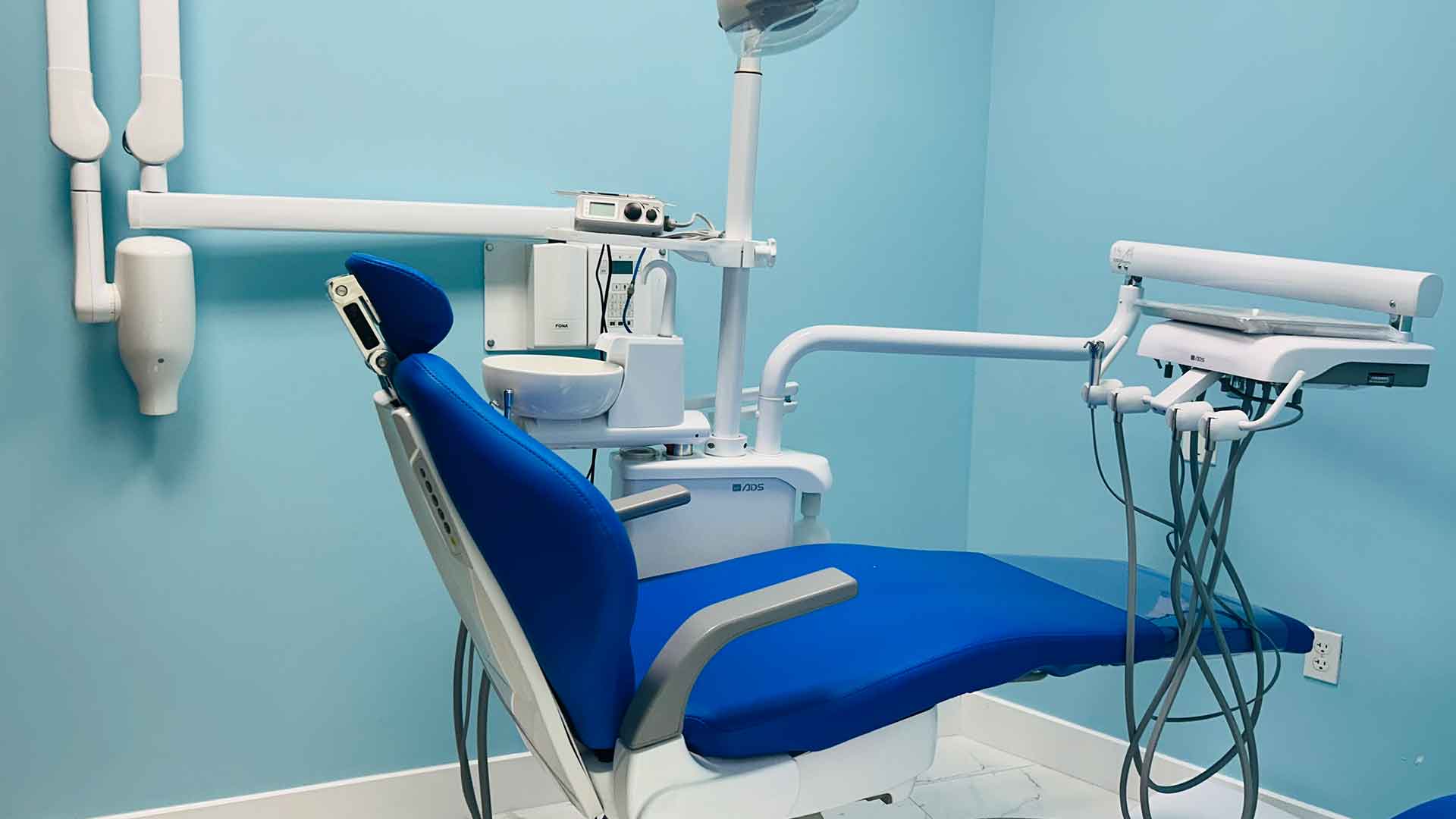 Invisalign Consultation Room at Dental Blush Bonita Springs Blue dental treatment room at Dental Blush Bonita Springs for clear aligner consultations