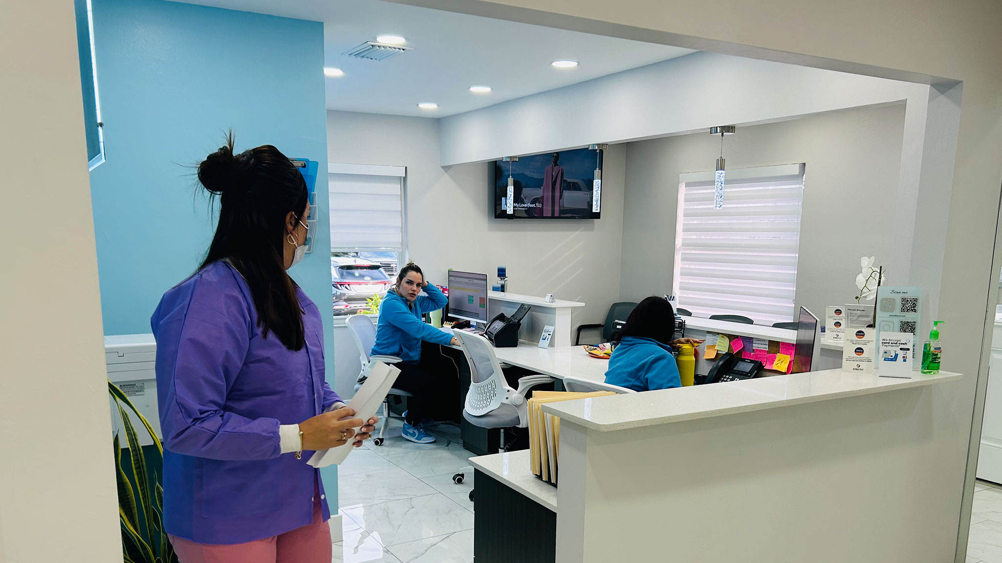 Patient having a conversation with Dental Blush Cape Coral team in clinic