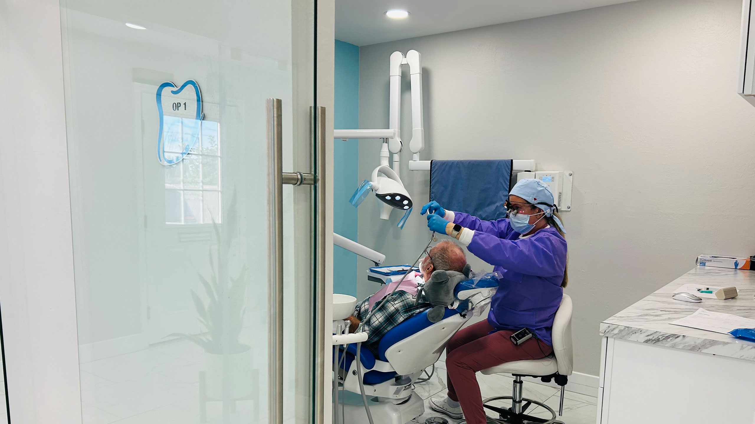 Sensitive teeth in Cape Coral patient receiving dental exam at Dental Blush Cape Coral