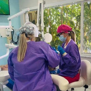 Dentist placing dental crown in Cape Coral at Dental Blush – Cape Coral, FL