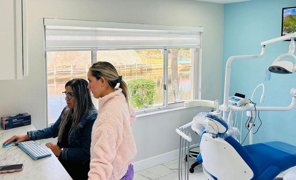 Dental Blush Cape Coral team discussing overdenture treatment with patient
