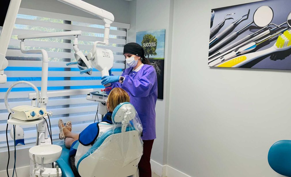 Cosmetic dentistry Miami FL with dental assistant preparing patient care at Dental Blush Tamiami