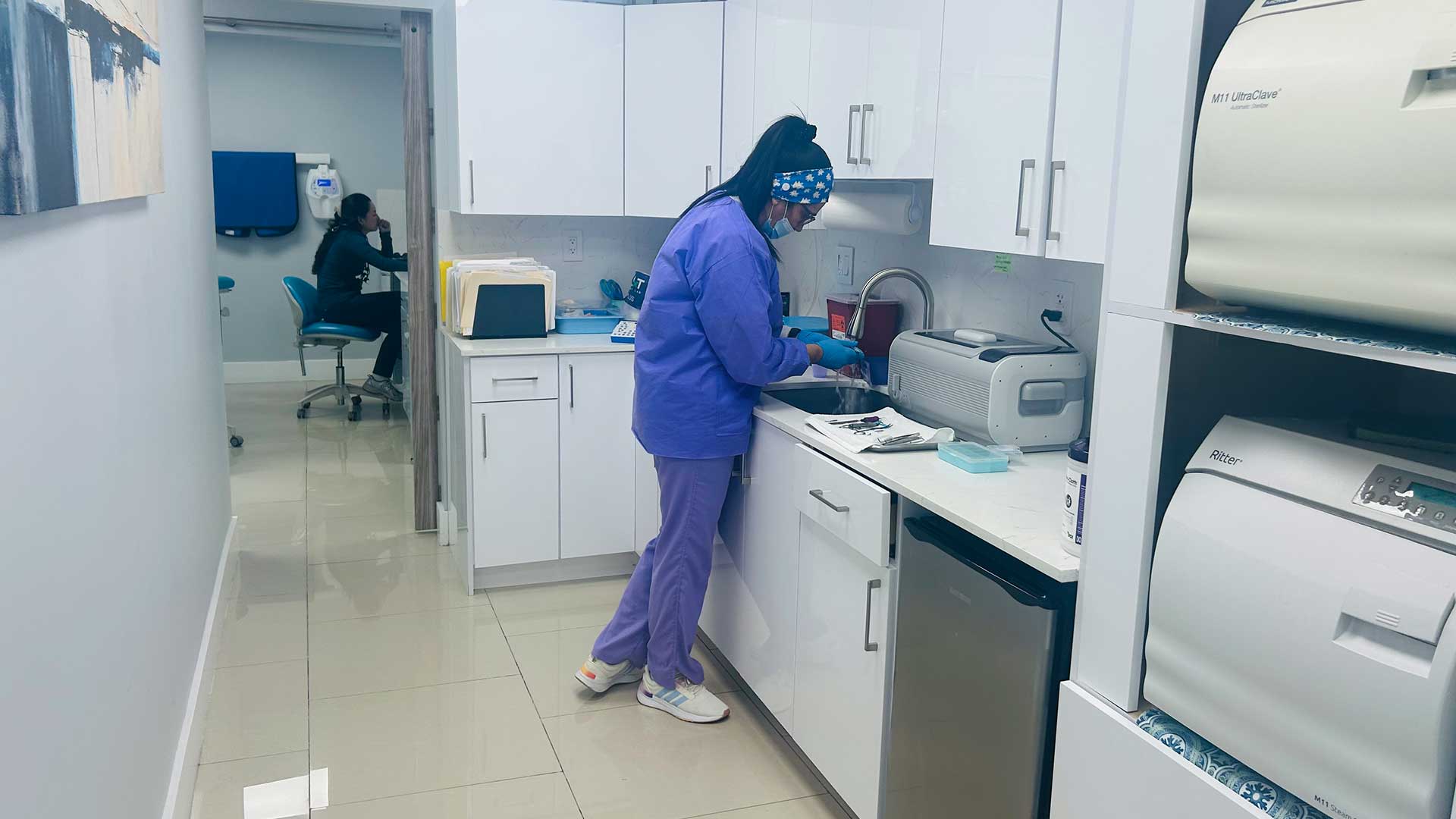 Dental team member preparing instruments at Dental Blush Tamiami in Miami-Dade County