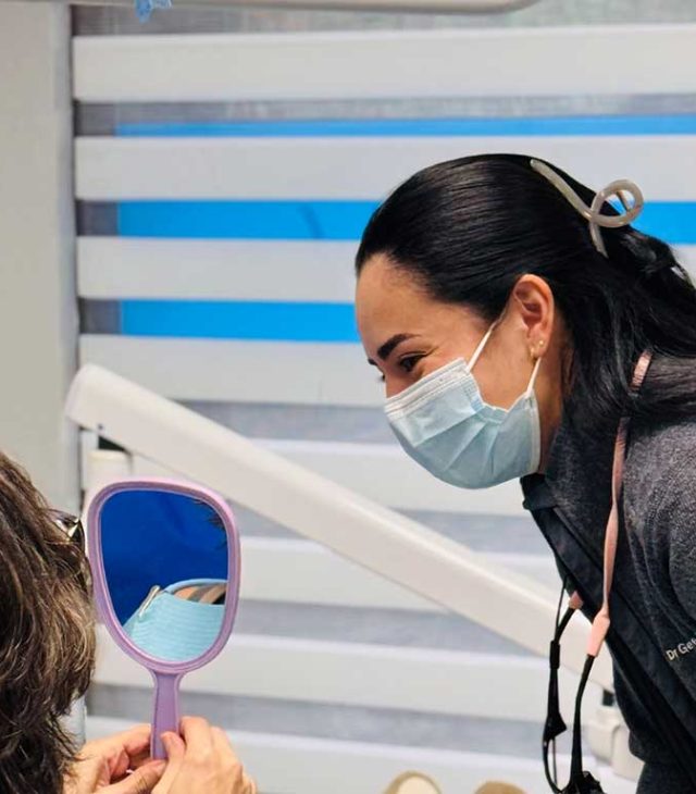Dr. Geraldine Pullas speaking with a patient at Dental Blush