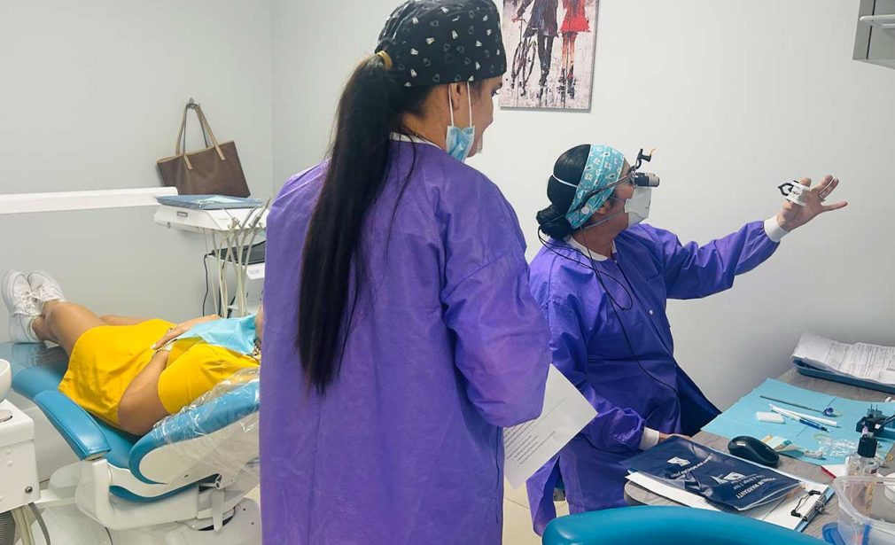 Dental team evaluating a patient for wisdom tooth removal in Miami