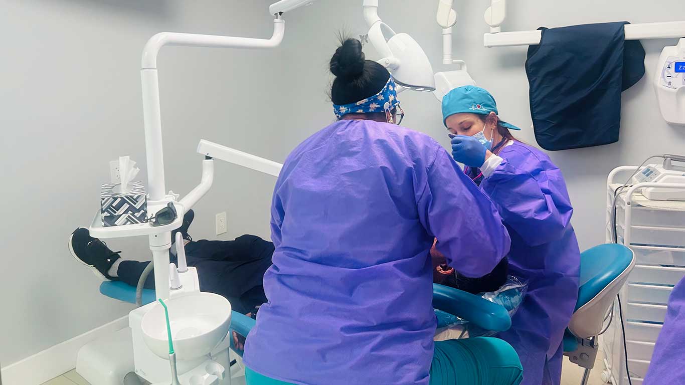 Wisdom Tooth Removal in Miami | Dental Blush Dental team performing wisdom tooth removal at Dental Blush in Miami